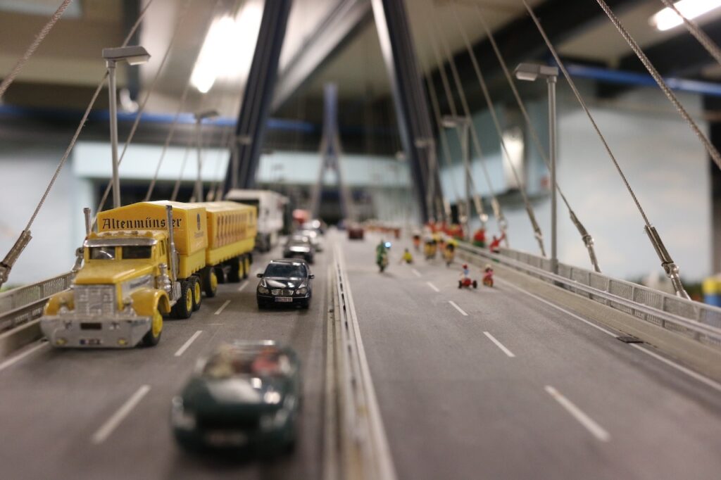 Trucks and cars on a motorway bridge at the Miniatur Wunderland, Hamburg, Germany